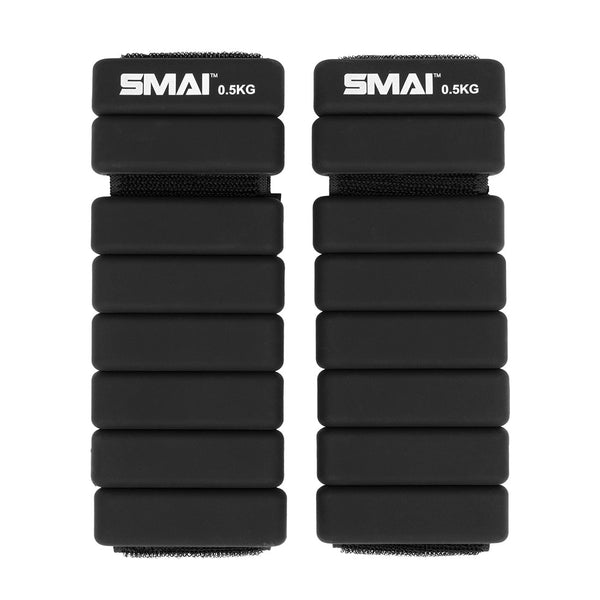 The SMAI Rebounder Mini Trampoline Pack includes a pair of black adjustable wrist or ankle weights, each marked "SMAI 0.5KG" with segmented rectangular sections—ideal for boosting your workout on the mini trampoline.