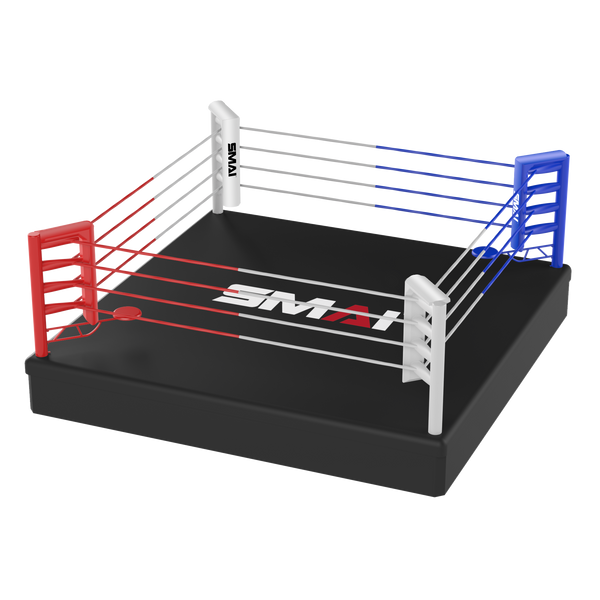 A small black boxing ring platform with red, white, and blue corner posts and ropes. It features branding with "SMAI" on the posts and the mat. The ropes and corners create a vibrant contrast against the dark surface.