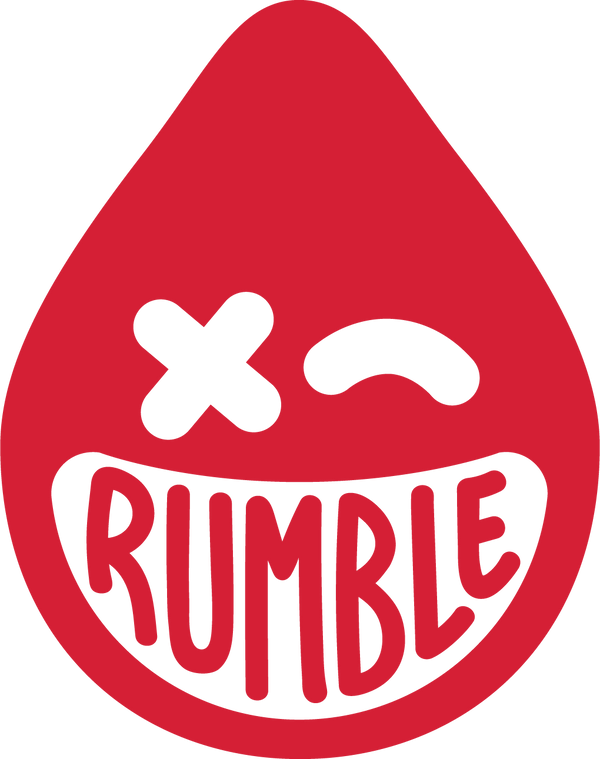 A red teardrop-shaped cartoon face with one eye as an "X," the other as a curved line, and a wide, toothy smile displaying the word "RUMBLE" in bold letters.