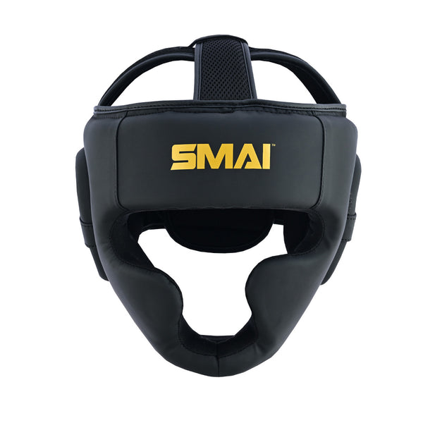The PRE-ORDER: Gold Series Boxing Headgear - Black/Gold by SMAI features EVA padding, open face design, and offers protection for the forehead, cheeks, and chin. Black with gold details and the SMAI logo on the front.