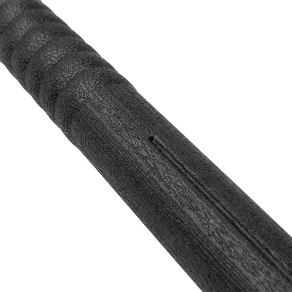 Wood grain detail of a plastic black bo staff