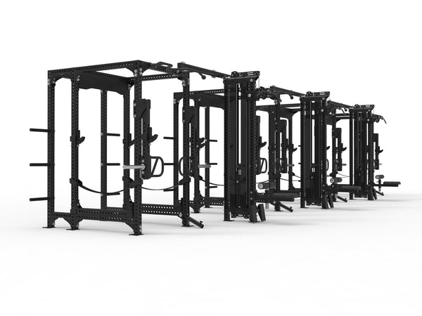A row of SMAI Vanta Series power racks, each equipped with lat pull towers, lines the gym. The minimalist black design contrasts with the white floor, featuring barbell holders and weight storage pegs to enhance functionality.