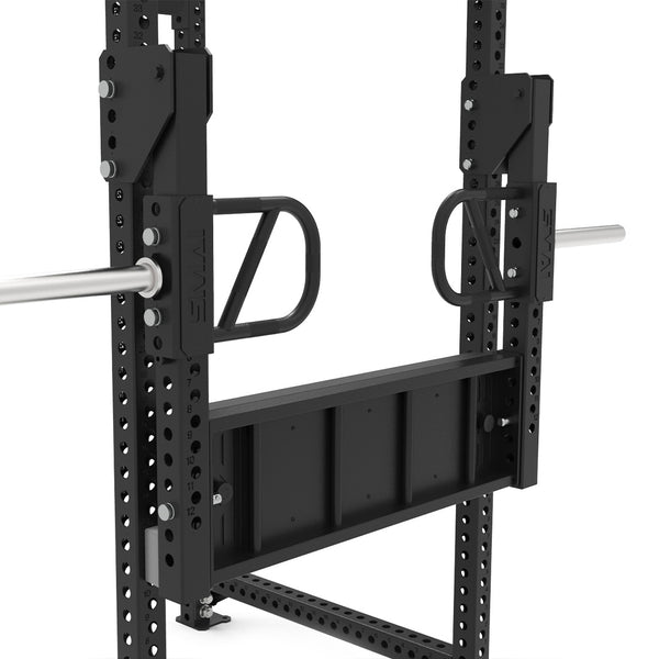 Close-up of the SMAI Leg Press Attachment - Vanta Series, featuring handles, a metal platform, and barbell sleeves. Mounted on a power rack with multiple holes for adjustable positioning—perfect for any home gym.