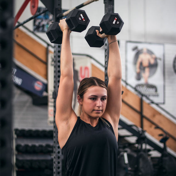 Woman using Jake Douglas CrossFit Athlete using 10kg Rubber Hex Dumbbells - Apex (Pair)