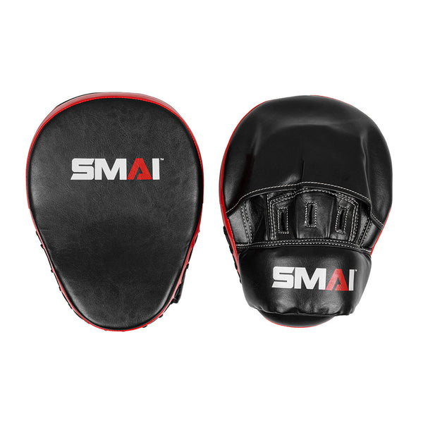 Two black and red SMAI Focus Mitt - Syntec pads are shown side by side: one displays the flat striking surface with the SMAI logo, the other shows the glove area and matching logo, highlighting these quality focus mitts.