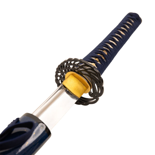 Close-up of the SMAI High Carbon Steel Tempered Katana - Midnight Sky, featuring a detailed tsuba, navy blue and tan wrapped handle, and a partially drawn blade from its dark blue sheath.