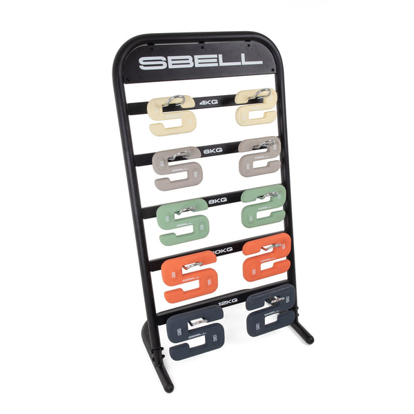 A sleek Sbell Training SBELL Stand holds vibrant weight plates in shades like beige (4kg) and navy blue (14kg), ideal for gym organization. Fitness enthusiasts will appreciate the clear kilogram labels on this sturdy black frame, with "SBELL" prominently displayed on top.
