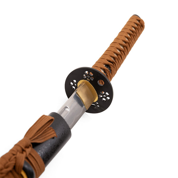 A close-up of the SMAI Aluminium Brown Display Katana - Draelthorn, partially drawn from its black scabbard, highlights a brown woven handle, decorative black guard, and shining steel blade.