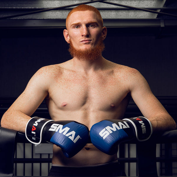 Zeke Campbell Wearing the SMAI ProGuard Blue Boxing Glove