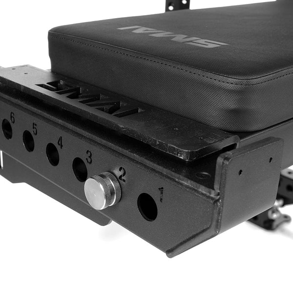 side view of utility bench attached to half rack using the spotting arms Close up of how bench is attached to spotting arms