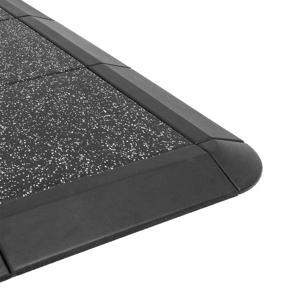 Close-up of the No Sync To Channel Engine Weight Lifting Platform showcases its speckled black rubber surface with beveled edges. The mat features a non-slip texture, rectangular shape, and rounded corners for durability and impact protection, making it ideal for weight lifting platforms.