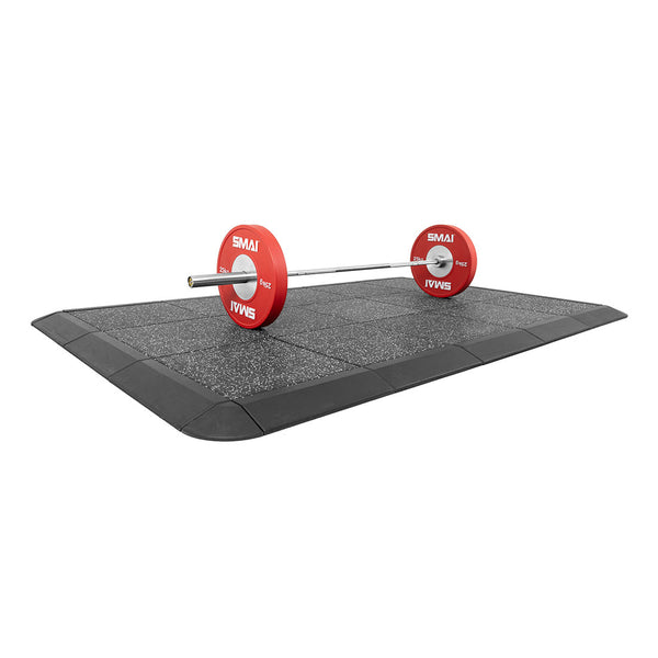 A barbell with red weight plates rests on the No Sync To Channel Engine "Weight Lifting Platform - Acoustic Rubber White Fleck 50mm," designed for impact protection with a textured surface. The platform has a black border and is set against a white background.