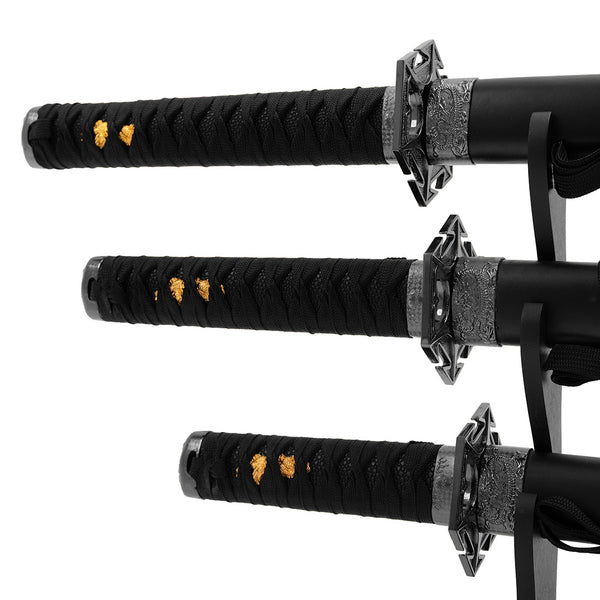 The SMAI Ninja 3pc Sword & Stand set features three Japanese-style swords with ornate silver guards, black braided handles, and gold accents, elegantly displayed on a stand against a white backdrop.