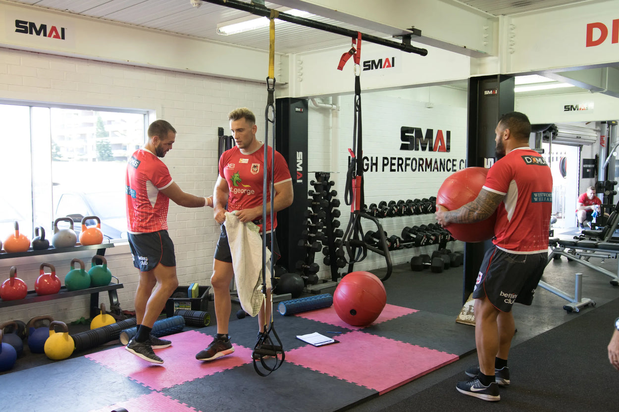 A group of men in a gym.