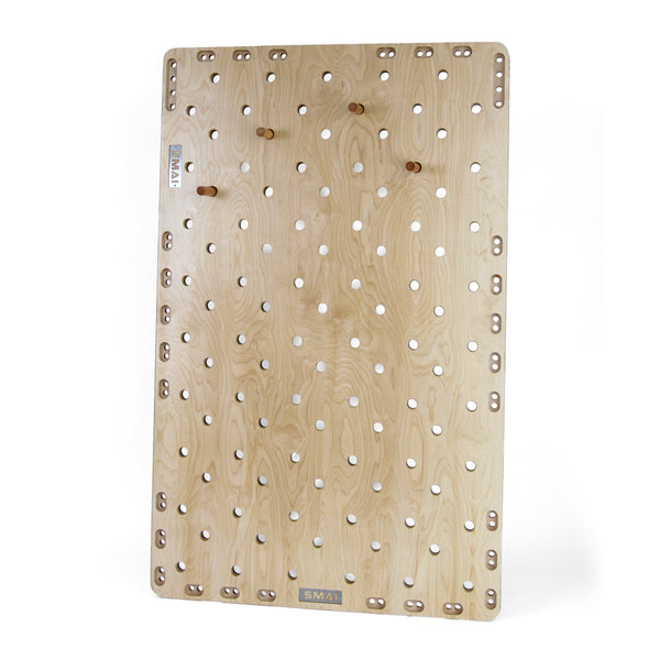 The SMAI Monster Peg Board is a large rectangular marine ply pegboard with multiple evenly spaced holes and several wooden pegs, displayed vertically against a white background.