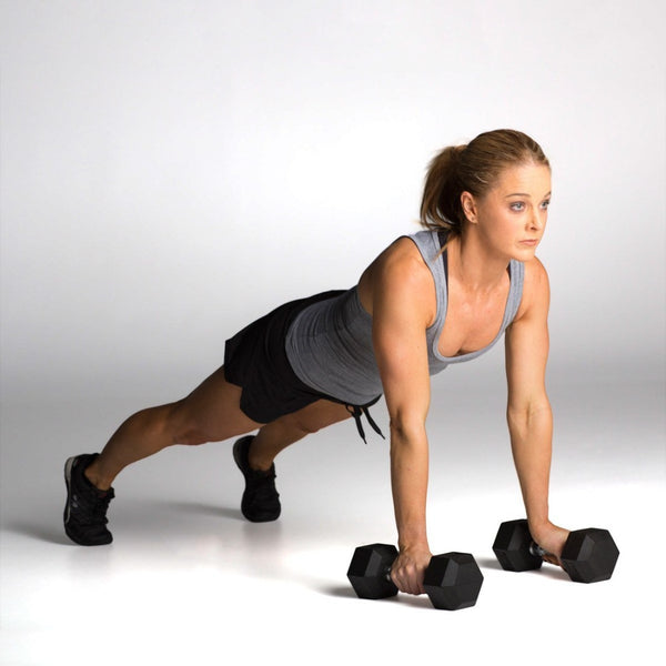 Woman using Rubber Hex Dumbbells (Pair) - Classic