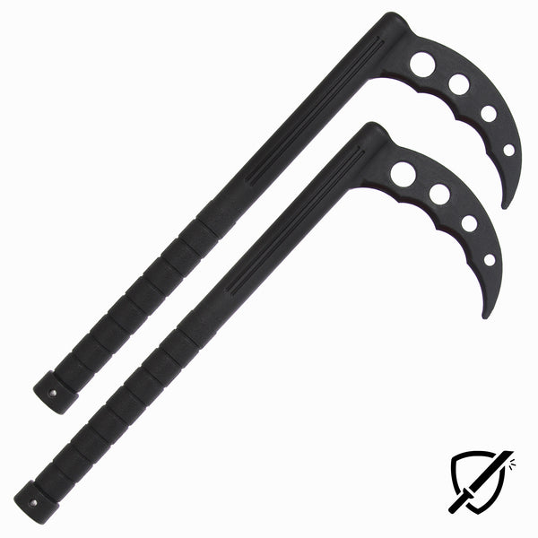 Two black SMAI Kama training swords, made from unbreakable polypropylene, feature curved blades and ringed handles. They lay parallel on a white background with a small shield icon and crossed-out sword in the lower right corner, reminiscent of Okinawan kobudo weaponry.