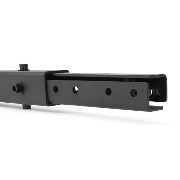 Close-up view of the "X-Frame - Upright Extension - 3ft" by No Sync To Channel Engine, featuring a black metal rectangular tube with holes and a sliding mechanism. This product suggests it could be part of a versatile modular system, ideal for use in rigs and rack kits.