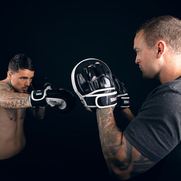 George Kambosos jr punching the SMAI Essentials Boxing Mitts Side View