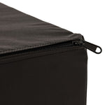 A close-up view of the SMAI Plyometric Box - Foam Covered - Black Series highlights a partially open zipper on its black fabric cover, revealing detailed stitching at the corner. Set against a plain background, the image focuses on the high-quality zipper and durable fabric texture—showcasing the robust construction and superior finish expected from essential training equipment by SMAI, specifically designed for box jumps.