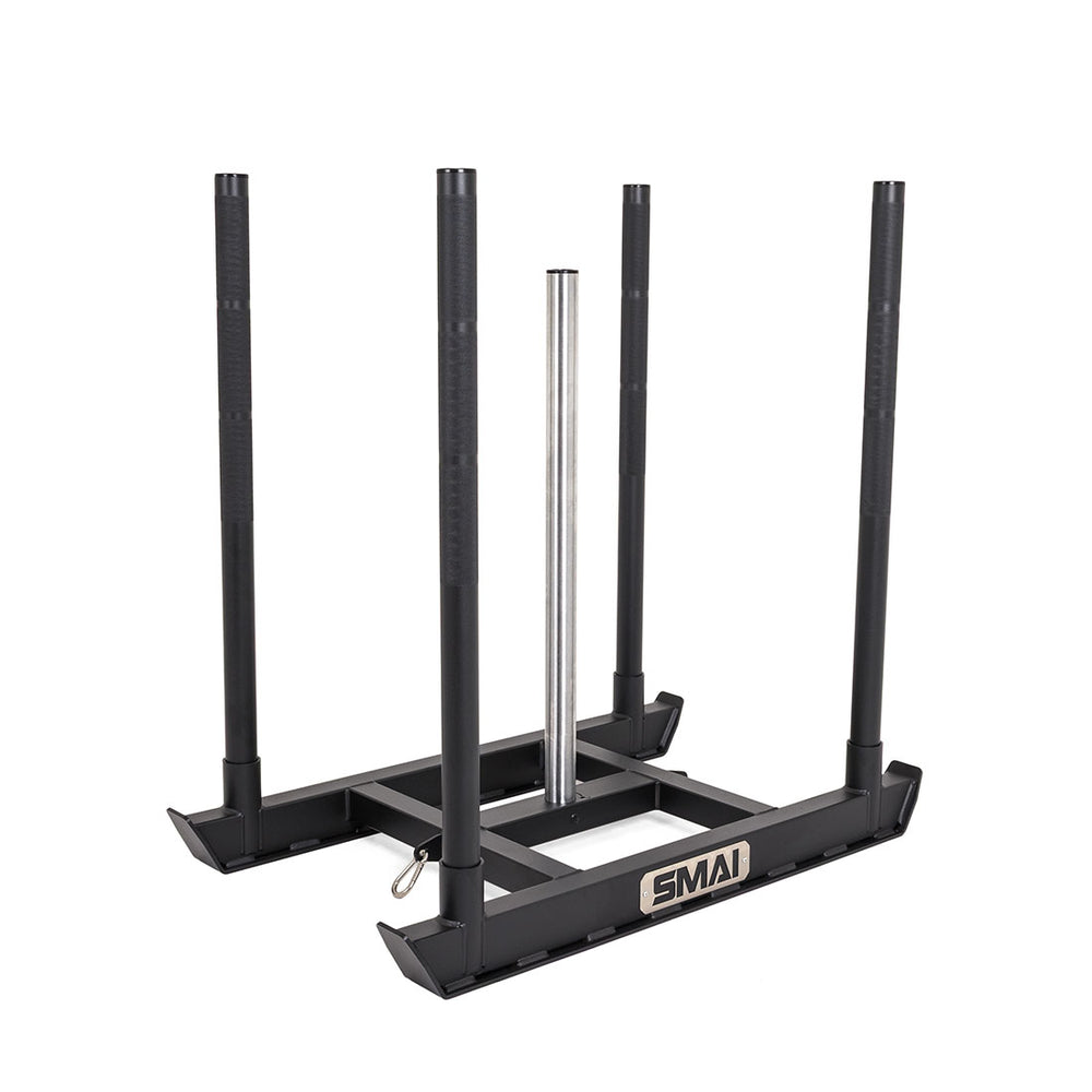 The SMAI Tower Gym Sled - Hybrid Series is a black metal sled featuring four upright handles and a central vertical pole for Olympic bumper plates, with “SMAI” displayed on the front. This hybrid training sled is ideal for pushing or pulling exercises.