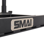 Close-up of the Tower Gym Sled - Hybrid Series frame, featuring a metal plate with the bold black “SMAI” logo. The plain background highlights the sled’s sturdy construction, making it ideal for intense workouts with gym sleds or hybrid training sleds.