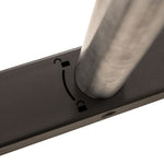 Close-up of a metal pole inserted into a rectangular base with a curved slot marked by locked and unlocked padlock symbols, indicating adjustable positioning—an ideal feature for securely attaching the SMAI Tower Gym Sled - Hybrid Series during workouts.