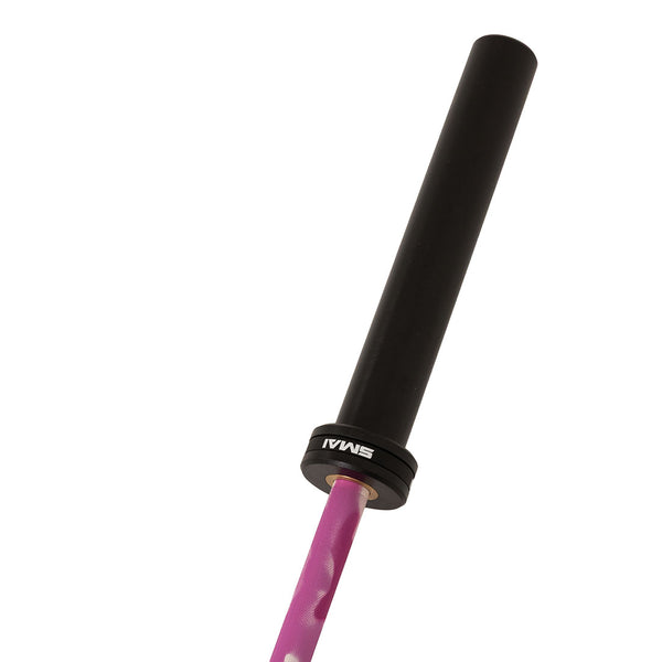 A close-up of the SMAI Barbell - Pink Camo - 15kg showcases a black sleeve, a pink camo-patterned textured shaft, and the “SMAI” brand printed on the collar near the sleeve.
