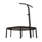 The SMAI Rebounder Mini Trampoline 50″ features a small, round design with a black frame, elastic bands, six sturdy legs, and an attached curved handlebar for added support. Set against a white background, it’s ideal as a fitness rebounder or bungee cord trampoline for low-impact exercise routines.