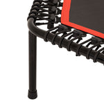 Close-up of a leg and corner of the SMAI Rebounder Mini Trampoline 50″, featuring elastic bungee cords securely attaching the black jumping surface with a red border to the metal frame—showcasing the sturdy construction of this premium fitness trampoline.