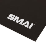 A close-up of the SMAI Exercise Mat - Extra Large (200cm x 122cm) in black, featuring the white “SMAI” logo printed in the corner.