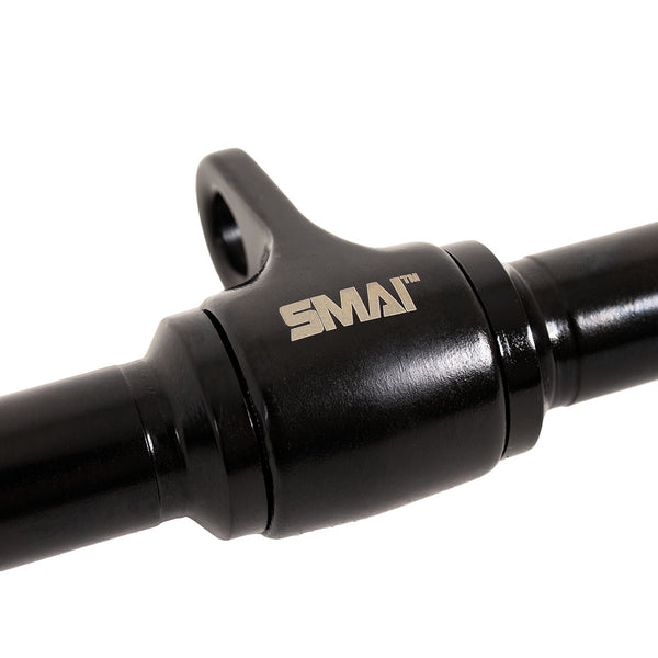 Close-up of a black metal SMAI Double D Row / Lat Pull Handle for a cable machine, featuring a central eyelet for a carabiner.