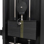 Close-up of the SMAI Functional Trainer - FTS Slide, a commercial-grade gym machine featuring multiple rectangular weight plates with an adjustable pin to select your desired weight; ideal for use in dual weight stack or functional training setups.