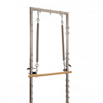 The SMAI Pilates - Classical Maple Reformer with Tower features two upper vertical springs and a lower horizontal wooden bar, ideal for exercise and physical therapy, shown against a white background.