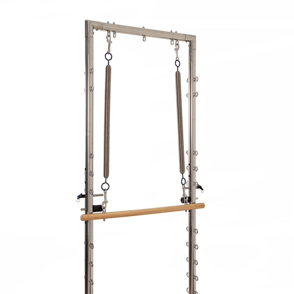 The SMAI Pilates - Classical Maple Reformer with Tower features two upper vertical springs and a lower horizontal wooden bar, ideal for exercise and physical therapy, shown against a white background.