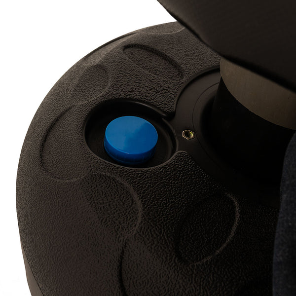 Close-up of the textured black circular base with a blue knob in the center from the SMAI Junior Punch Master - Black, set against a white background.
