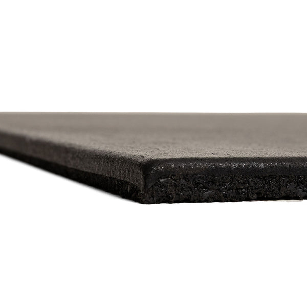 Close-up side view of a single SMAI EPDM Rubber Gym Flooring Tile - 15mm - Black, highlighting its thickness and slightly textured black surface against a white background.