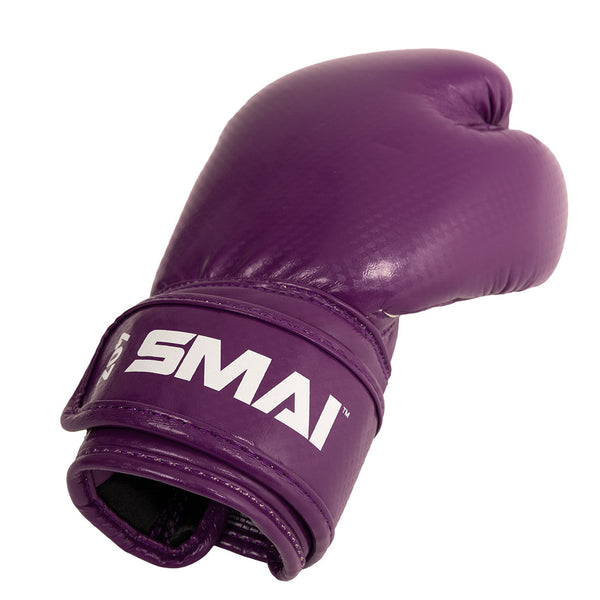 A single Essentials Kids Boxing Glove in purple by SMAI, featuring the brand name printed in white on the wrist strap and set against a white background—ideal for young champions or anyone looking for stylish kids boxing gloves.