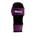 The Essentials Muay Thai Shin Instep Guard Kids - Purple by SMAI is a kids martial arts shin guard featuring white “SMAI” and “LEFT” text. It includes two adjustable straps for secure leg fit, making it an ideal choice for young athletes.