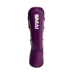 Introducing the Essentials Muay Thai Shin Instep Guard Kids in Purple by SMAI—featuring the brand’s white logo against a vibrant purple, these kids’ shin guards are expertly crafted for martial arts, providing dependable protection and comfort.
