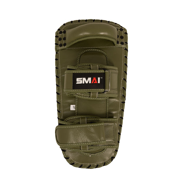 Introducing the SMAI Thai Arm Pads V2 (Pair) in olive green, expertly crafted from high-grade leather. Each pad is designed with black lacing, two padded straps, and a durable handle on the back for secure handling. Featuring layered foam construction for optimal shock absorption, the pads display the SMAI logo in white, red, and black. They are presented against a white background.