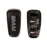 Two grey rectangular Essentials Muay Thai Pads (Pair) from SMAI are made from durable synthetic leather. One pad displays the front with the “SMAI” logo, while the other shows the back, featuring two adjustable straps and a grip handle—ideal for intense kickboxing training or use as Muay Thai pads.
