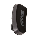 A pair of black and gray Essentials Muay Thai Pads (Economy Grey) by SMAI, crafted from durable synthetic leather with “SMAI” boldly printed on the front, shown angled to display detailed side stitching and a sturdy rear handle—perfect for kickboxing training or use as Muay Thai pads.