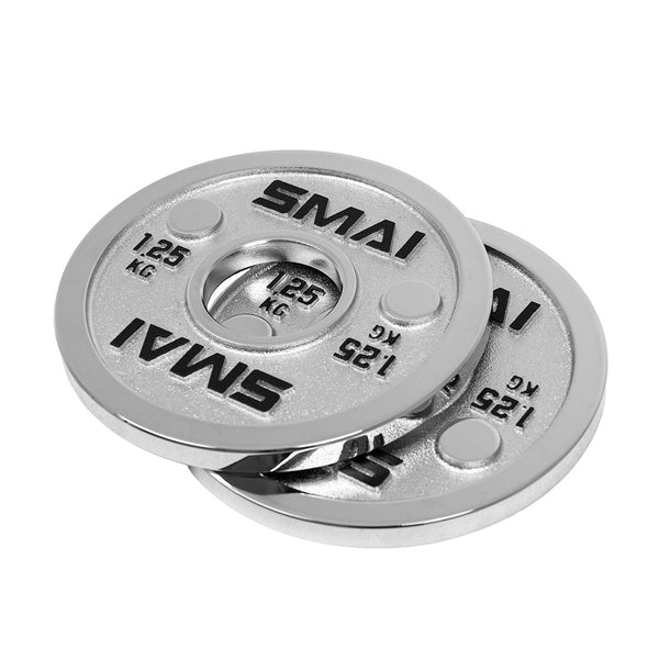 Two silver-colored SMAI Calibrated Steel Change Plates, each labeled “SMAI” and “1.25 KG,” are stacked on top of each other with one partially overlapping the other, set against a white background.