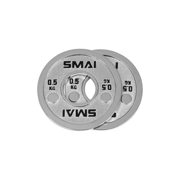 Two silver metal Calibrated Steel Change Plates from SMAI, each labeled “SMAI” and “0.5 KG,” are overlapping on a white background. These micro increment plates are ideal for making precise adjustments during powerlifting training.