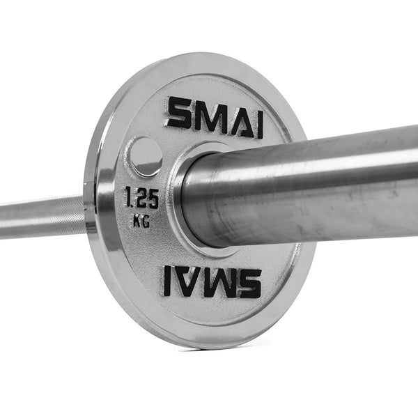 Close-up of a shiny silver barbell with SMAI Calibrated Steel Change Plates, each weighing 1.25 kg and labeled “SMAI” on both sides, set against a white background—showcasing premium micro increment weight plates ideal for precise training adjustments.