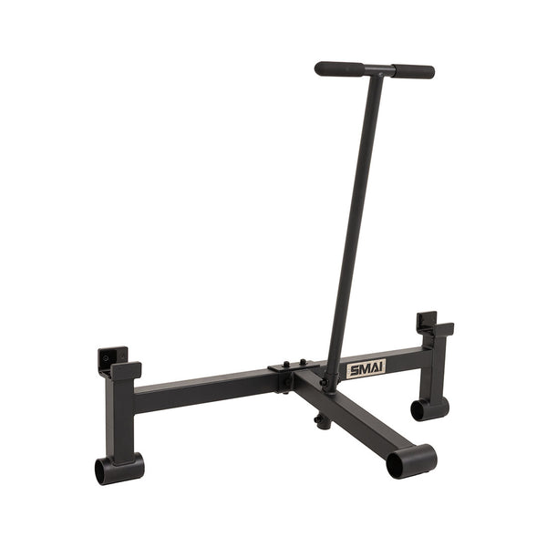 The SMAI Barbell Jack - Double is a black metal sled featuring an upright handlebar and two cylindrical feet, engineered for strength training exercises such as pushing or pulling weights. Comparable in function to a deadlift jack, it assists with heavy lifting during intense gym sessions, with the “SMAI” logo displayed on the frame.