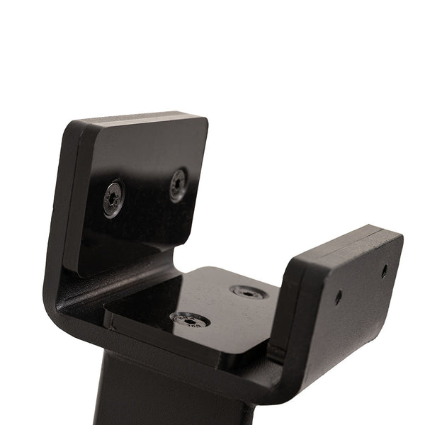 Close-up of the SMAI Barbell Jack – Double, a black metal bracket featuring two perpendicular plates secured by screws. This sturdy mounting or support component is designed for use in deadlift jack assemblies, facilitating effortless barbell loading and unloading.