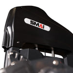 Close-up of the Leg Extension / Leg Curl Machine - 2 in 1 by SMAI, featuring the brand’s white logo label. The image highlights part of the machine’s upper structure and metal rods, emphasizing its durable build as commercial gym equipment.