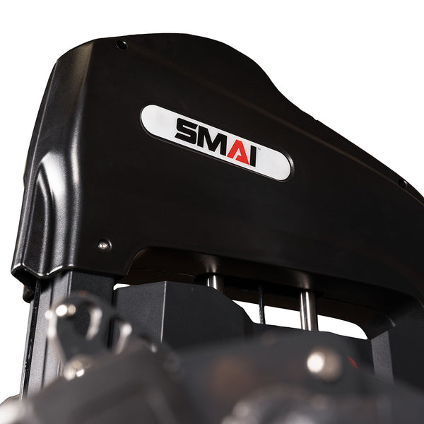 Close-up of the Leg Extension / Leg Curl Machine - 2 in 1 by SMAI, featuring the brand’s white logo label. The image highlights part of the machine’s upper structure and metal rods, emphasizing its durable build as commercial gym equipment.